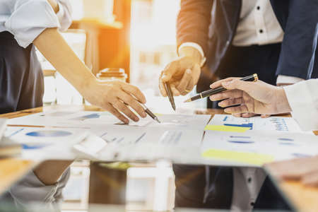 Executives and managers are meeting in a conference room, on the table there are some documents about the company's finances, managers are discussing financial information with the management.の写真素材
