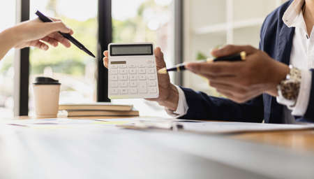 Meeting room atmosphere of a startup company, the finance department is meeting with executives to present financial programs, brainstorming sessions. Concept of company financial management.の写真素材