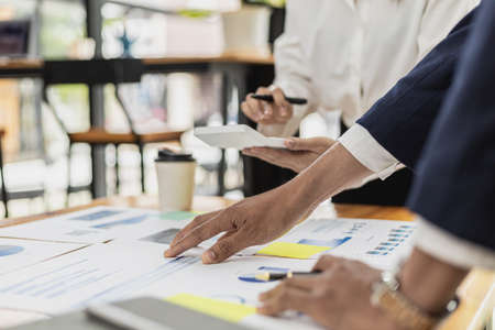Atmosphere in the meeting room of startup companies, executives and marketing departments are discussing and brainstorming online marketing plans. Marketing management concept of startup company.の写真素材