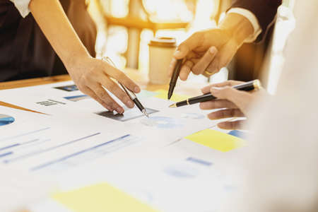 Executives and managers are meeting in a conference room, on the table there are some documents about the company's finances, managers are discussing financial information with the management.の写真素材