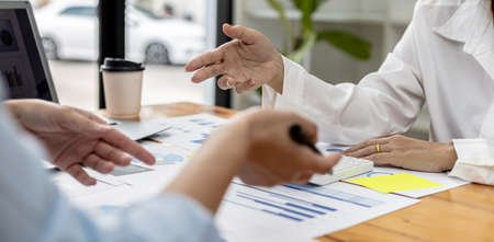 Atmosphere in the meeting room of startup companies, executives and sales departments gather together to summarize sales for analysis and planning. Sales management concept of startup company.の写真素材