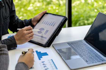 The atmosphere in the conference room was attended by two businessmen, a joint company operating...