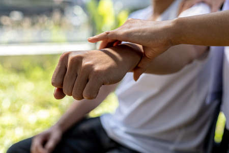 A physical therapist is doing physical therapy on a patient, the patient has muscle dysfunction due to hard work, most often an office worker who has problems sitting for long periods of time.の写真素材