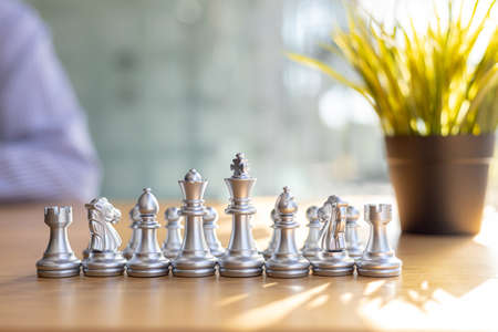 Golden chess pieces lined up in front, business planning ideas and operational strategies to make the business profitable and growing. Strengths in business operations.の写真素材
