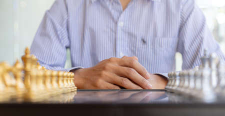 Golden chess pieces lined up in front, business planning ideas and operational strategies to make...