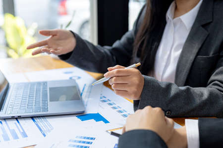 Meeting room atmosphere, business people meeting together on finance topics, they are working...