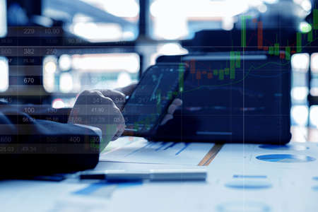 Finance business investment ideas, stock market investment, digital finance, cryptocurrencies, bank mutual funds and digital assets. Investors analyze the charts to see the ups and downs of a trade.の写真素材