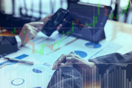 Finance business investment ideas, stock market investment, digital finance, cryptocurrencies, bank mutual funds and digital assets. Investors analyze the charts to see the ups and downs of a trade.の写真素材