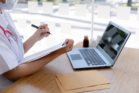Doctors video calling with patients, Doctors discussing diseases with patients to diagnose and treat the disease via video call. Concept of video call investigation between doctor and patient.の写真素材