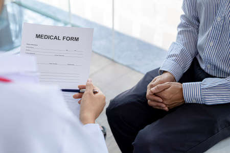 An examination room atmosphere in a hospital where doctors and patients are examining and diagnosing...