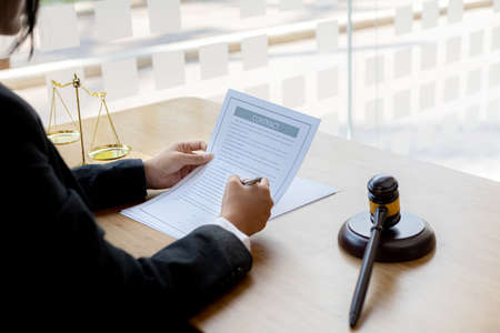 Attorneys are reviewing contract documents for the client, in which the client has filed a lawsuit...
