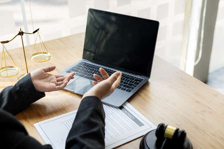 Lawyers are advising clients via video call in embezzlement cases, explaining the details of the...