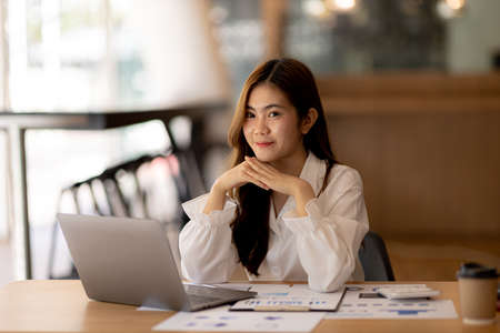 Beautiful Asian woman is a businesswoman who leads a new generation of startups, a woman who runs...