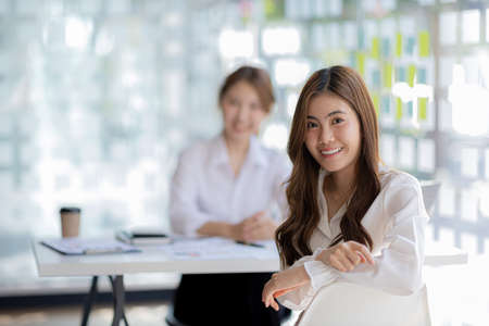 Beautiful Asian woman is a businesswoman who leads a new generation of startups, a woman who runs...