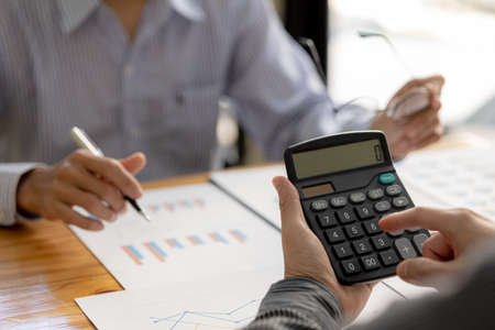 Atmosphere brainstorming session of a startup company, two founders of the company attended a...