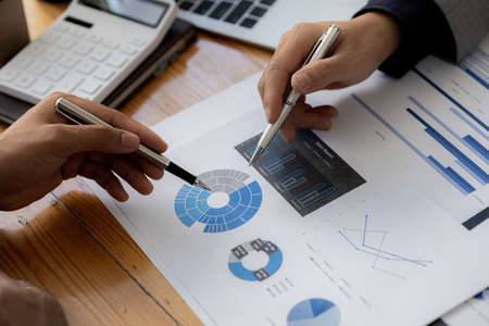 Atmosphere in the conference room where two business people are meeting and brainstorming, young...