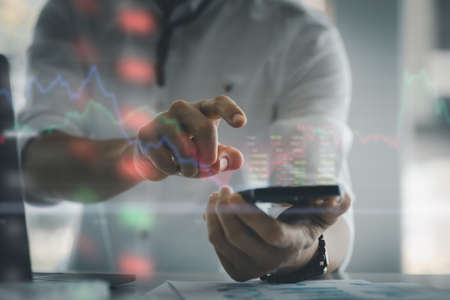 Person holding smartphone, business analysis, stock market report, technology concept. Finance...