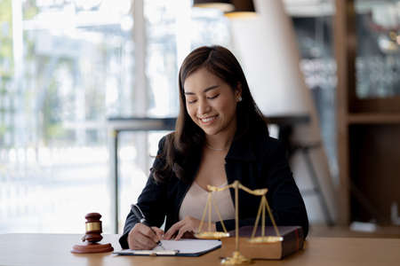 Woman sitting in the office, she's a good woman lawyer, she's a lawyer serving clients to fight...