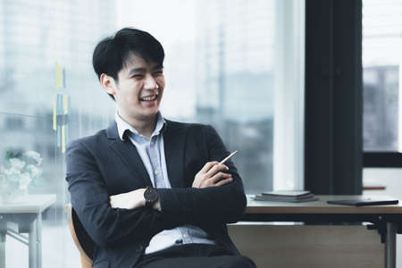 Asian man with suit, young businessman as startup company CEO, executive room, young startup company...