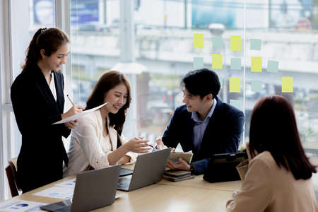 Meeting room atmosphere and business groups are meeting, discussing and planning business operations for more profitable growth. Concept of business meeting and company administration.の写真素材