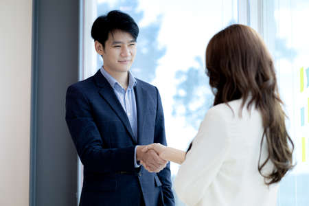 Business dealings and handshakes, startup company marketing team meetings, brainstorming sessions for implementation planning, management by new generations. The idea of opening a startup company.の写真素材
