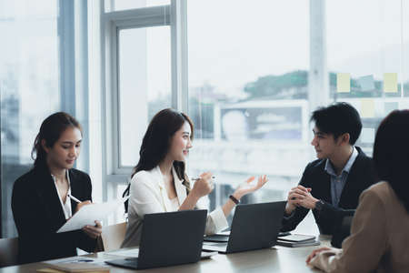 Meeting room atmosphere and business groups are meeting, discussing and planning business operations for more profitable growth. Concept of business meeting and company administration.の写真素材