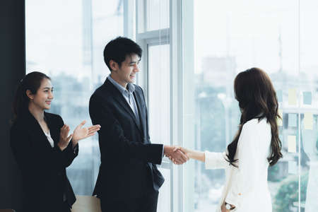 Business dealings and handshakes, startup company marketing team meetings, brainstorming sessions for implementation planning, management by new generations. The idea of opening a startup company.の写真素材