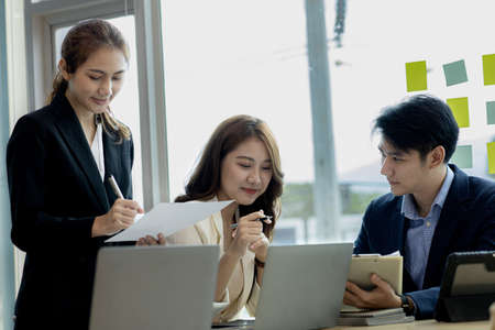 Meeting room atmosphere and business groups are meeting, discussing and planning business operations for more profitable growth. Concept of business meeting and company administration.の写真素材