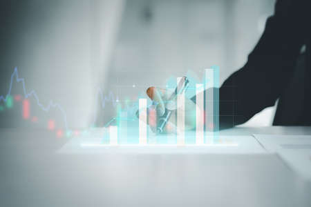 A business woman examines data on financial documents, company financial reports, graphics showing...
