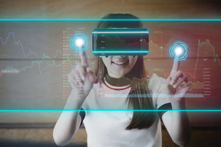 Woman wearing virtual reality glasses to use the technology of the future, using virtual reality...