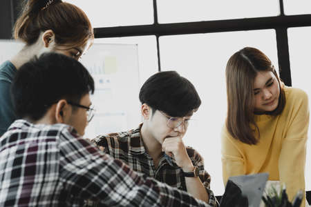 Groups of people gathered in the conference room, they were having a brainstorming meeting and...