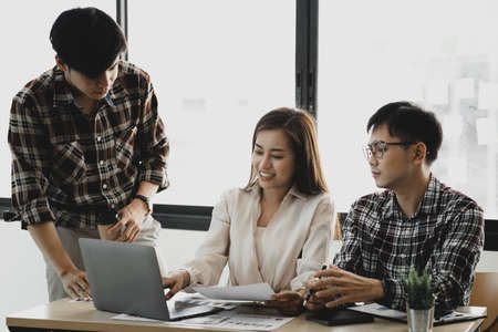 Groups of people gathered in the conference room, they were having a brainstorming meeting and planning meetings to manage the company's growth and profit. Management concept from the new generation.の写真素材