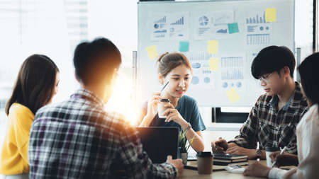 Groups of people gathered in the conference room, they were having a brainstorming meeting and planning meetings to manage the company's growth and profit. Management concept from the new generation.の写真素材