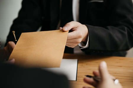 Attorneys are accepting documents from clients who come in to testify in case of embezzlement from...