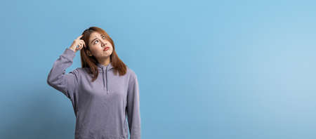 Portrait of beautiful Asian woman expressing thoughtful and doubtful expressions on isolated...