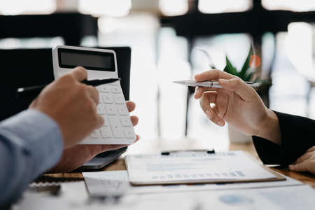 Business man group are meeting together in the office, they are meeting on the topic of finance and financial management, they are business partners. Concept financial management for startup companiesの写真素材