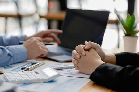 Company meeting room has businessmen and finance managers meeting together on finance topics, they...