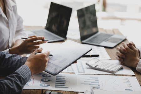 Business man group are meeting together in the office, they are meeting on the topic of finance and...