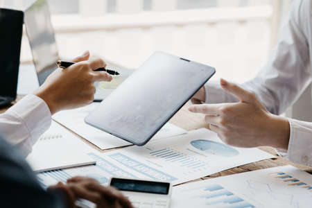 Business man group are meeting together in the office, they are meeting on the topic of finance and financial management, they are business partners. Concept financial management for startup companiesの写真素材