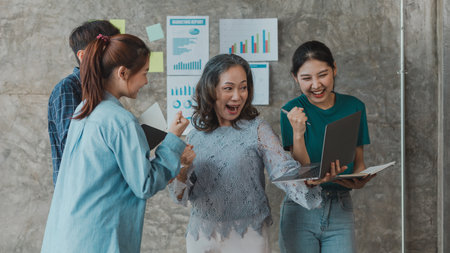 Senior businesswoman, senior management and team showing joy together, she is meeting with department head staff at the conference room, senior female executives and young staff working together.の写真素材