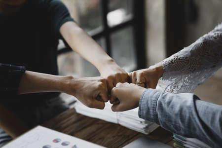 Collaboration of corporate teams, groups of people are collaborating to create positive energy in collaboration, startup company planning meetings. To make progress with the cooperation quality team.の写真素材