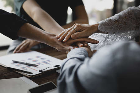 Collaboration of corporate teams, groups of people are collaborating to create positive energy in...