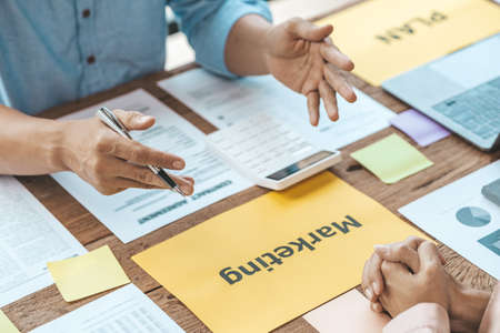 The meeting room for startup companies, the marketing department has a meeting to plan marketing and summary of the department's performance, a meeting to analyze the company's target customers.の写真素材