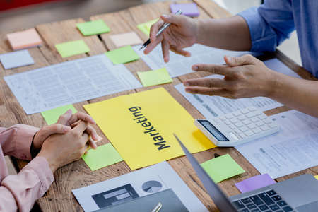 The meeting room for startup companies, the marketing department has a meeting to plan marketing and summary of the department's performance, a meeting to analyze the company's target customers.の写真素材