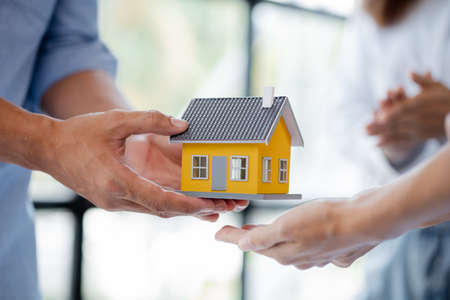 Architects who design buildings and houses submit model homes to housing project owners to present...