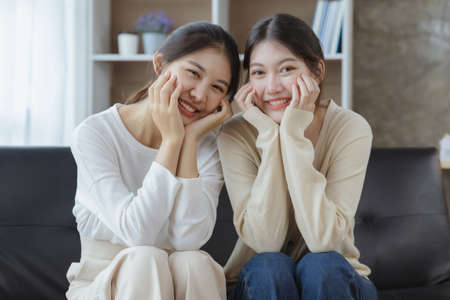 Two beautiful Asian women in a homosexual relationship, queer, gay couple, advocating sexual independence and pride in LGBTQ. Lgbt and love relationship. Supporters of the LGBT community.の写真素材