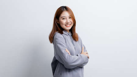 Beautiful Asian woman gesturing for advertisement editing on isolated background, portrait concept used for advertisement and signage, isolated over white background, copy space.の写真素材