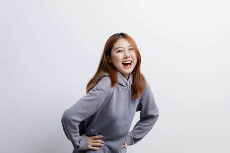 Beautiful Asian woman gesturing for advertisement editing on isolated background, portrait concept used for advertisement and signage, isolated over white background, copy space.の写真素材