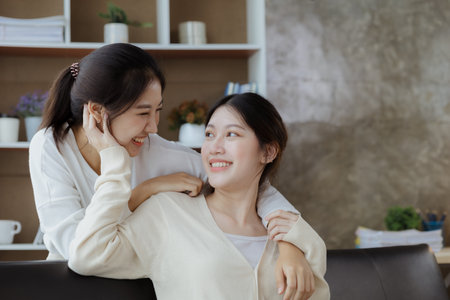 Two beautiful Asian women in a homosexual relationship, queer, gay couple, advocating sexual independence and pride in LGBTQ. Lgbt and love relationship. Supporters of the LGBT community.の写真素材
