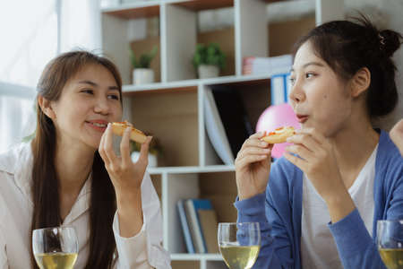 Group of young Asians having fun at company parties, startup parties, new year parties, annual...